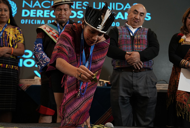 An indigenous person performing a ceremony