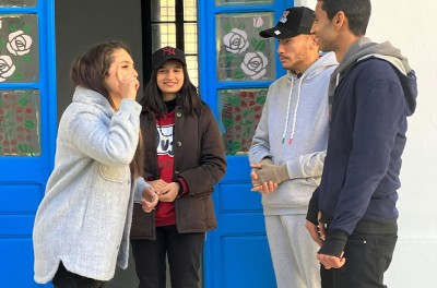 Three youngsters communicate through sign language. © Credit – OHCHR Tunisia