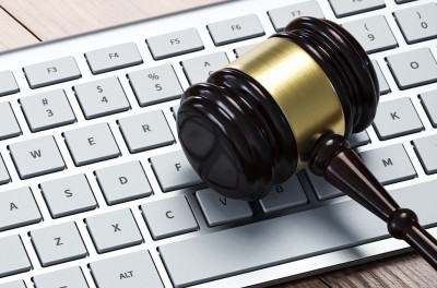 A gavel resting on a white computer keyboard. © Getty Images
