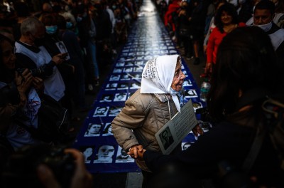 Argentines participate in a march for National Day of Memory for Truth and Justice, which commemorates the 1976 military coup. © Credit – EPA-EFE/Juan Ignacio Roncoroni.