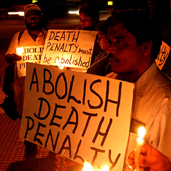 Members of the South India Cell for Human Right Education and Monitoring (SICHREM) hold placards during a candle light demonstration in Bangalore calling the government to abolish the death penalty, Monday 10 October 2005. © EPA/Manjunath Kiran