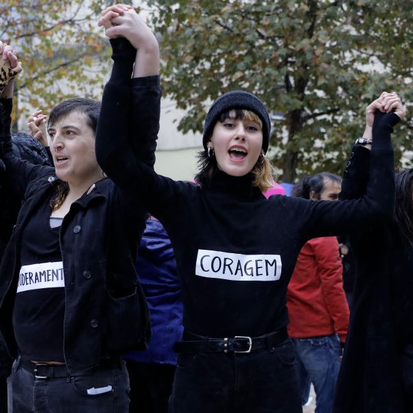 Participants hold black sweaters with the word courage attached during a demonstration on the occasion of the International Day for the Elimination of Violence Against Women, in Lisbon, Portugal, 25 November 2018. © EPA-EFE/Antonio Cotrim