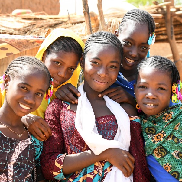 Group of five young girls smiling