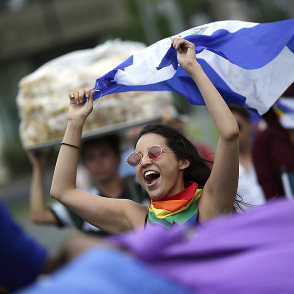 A young girl waves a Nicaraguan flag during the LGBTI pride march in Managua, Nicaragua, 28 June 2018