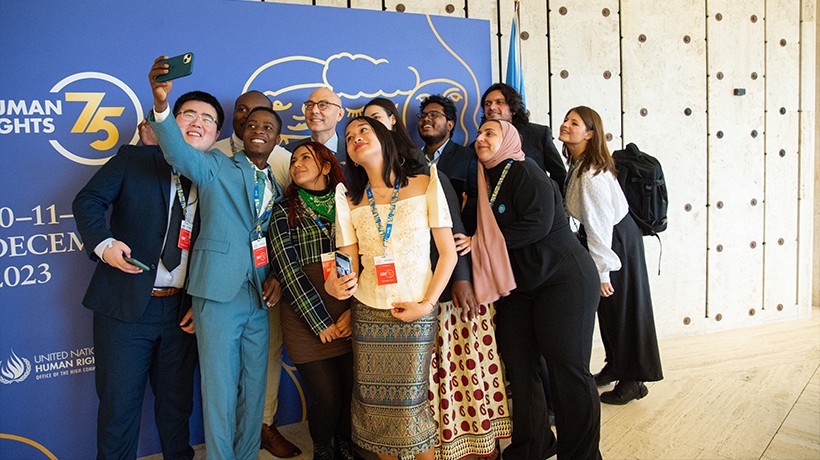 UN Human Rights Chief Volker Türk poses for a group picture with members of the Youth Advisory Group, which is tasked with ensuring that young people have a voice in the development of human rights commitments for the future. ©OHCHR/Irina Popa
