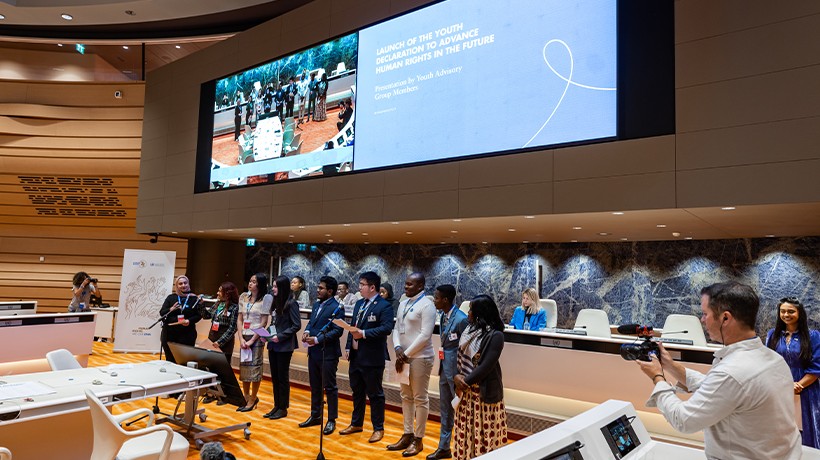 Members of the Youth Advisory Group unveil the Human Rights 75 Youth Declaration, which reflects young people's views on the future of human rights. ©OHCHR/Pierre Albouy