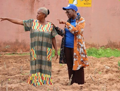 Aminata Kebe, Coordinator of the PAPEV project and Georgina Da Silva responsible for the management of the AMIC centre for the reception of young girls visiting the market garden. ©OHCHR WARO Habibou