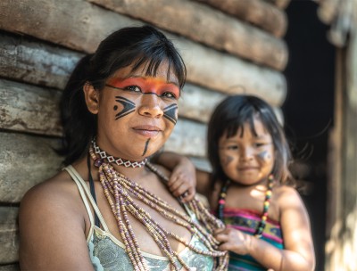 A Brazilian young woman and her child, portrait of Tupi Guarani ethnicity. © Credit Getty Images. 