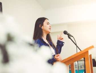 (Young girl giving a speech) © Credit – GettyImages/Lisa5201