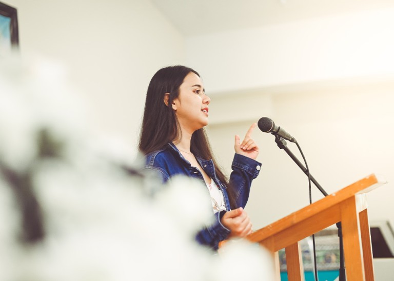 (Young girl giving a speech) © Credit – GettyImages/Lisa5201