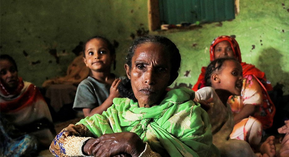 Ethiopian woman with children behind