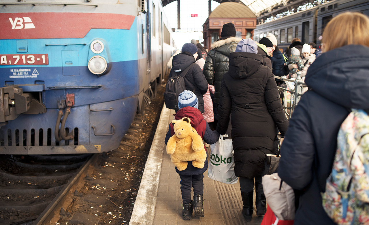 Ukrainians wait for trains to leave the country