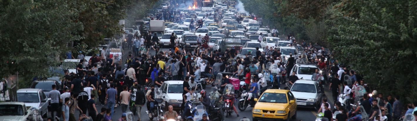 People clash with police during a protest following the death of Mahsa Amini, in Tehran, Iran, 21 September 2022. ©EPA-EFE