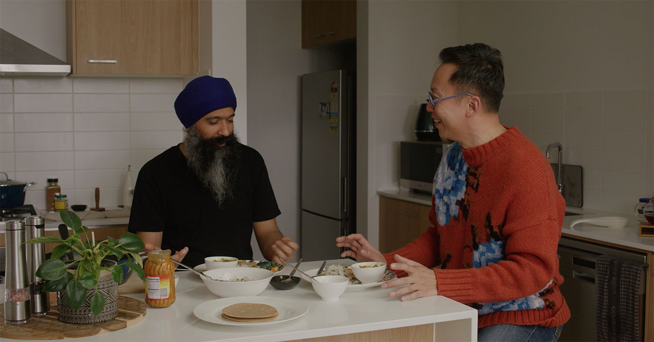 A Malaysian MasterChef contestant and a Sikh hip-hop artist sharing a meal in the kitchen