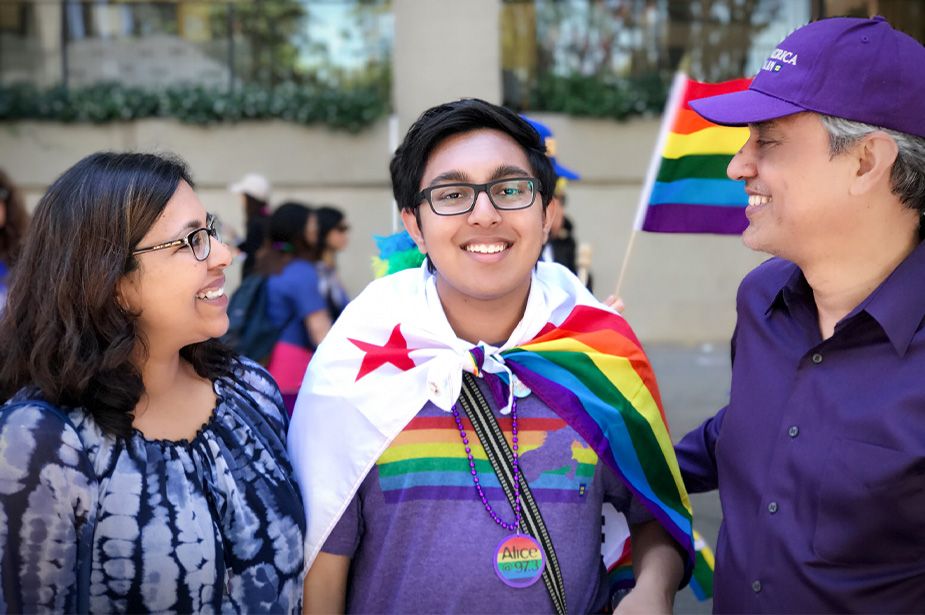 Sameer Jha shown with his father and mother at San Francisco Pride 2017 in the United States. ©Sameer Jha
