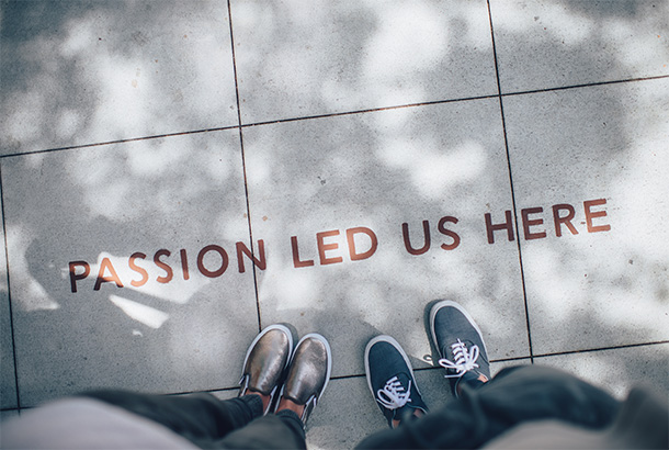 Two persons standing on gray tile paving. Photo by Ian Schneider, @goian, from 19 February 2016 on Unsplash 