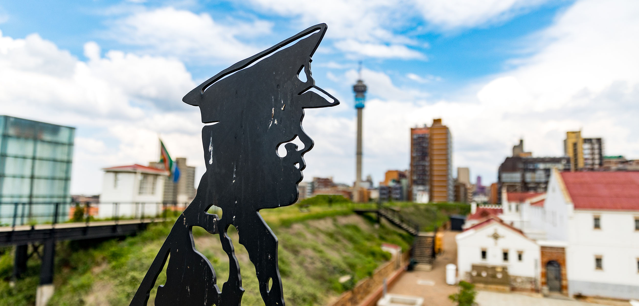 A sculpture of a police officer overlooks the prison that housed Nelson Mandela  at Constitution Hill. Since the 1990s, the site has been the home of South Africa’s Constitutional Court and is a living museum telling the story of the country’s journey from colonialism to Apartheid to democracy. Credit: OHCHR ROSA