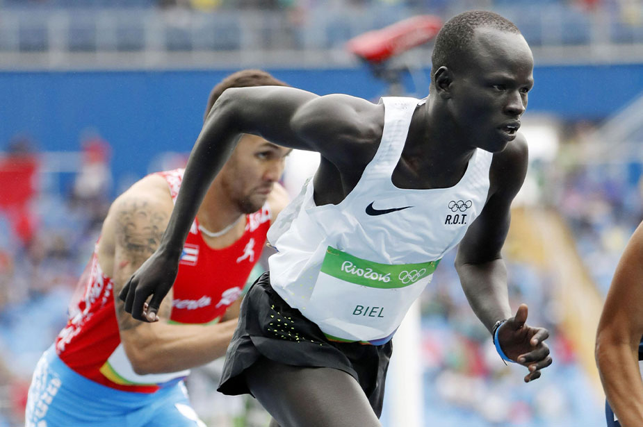 Yiech Pur Biel from South Sudan of the Refugee Olympic Team runs in a men's 800-meter heat during the athletics competitions of the Summer Olympics at the Olympic stadium in Rio de Janeiro on Aug. 12, 2016. © Reuters