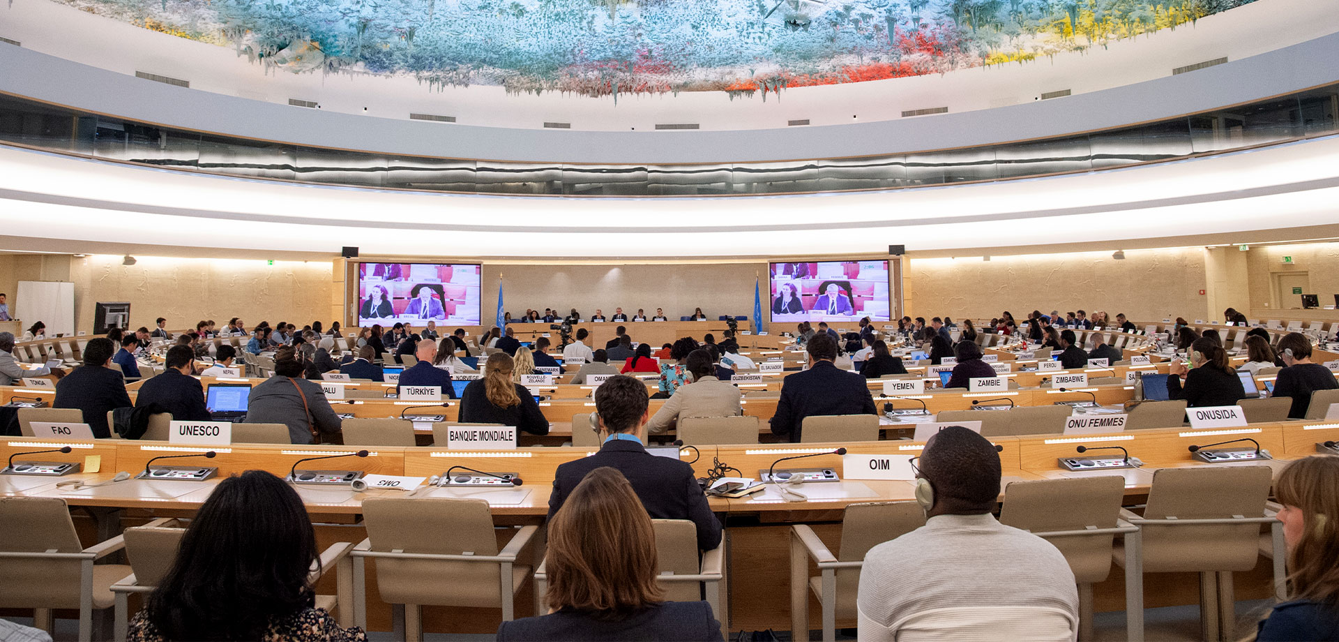 A group of people in a conference room