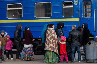 A family waiting at a train station. 