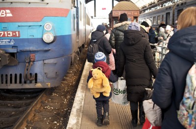 Ukrainians wait for trains to leave the country