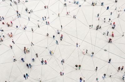 Aerial view of crowd connected by lines © Orbon Aliyah, Getty Images