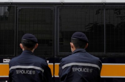 A prison van arrives at West Kowloon Magistrates' Courts building, as the hearing for the 47 pro-democracy activists, charged with conspiracy to commit subversion under the national security law, continues, in Hong Kong, China February 4, 2022. © Reuters