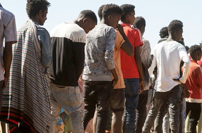 Ethiopian refugees from Tigray region wait in line to receive aid at the Um Rakuba refugee camp, the same camp that hosted Ethiopian refugees during the famine in the 1980s, some 80 kilometres from the Ethiopian-Sudan border in Sudan, 30 November 2020 (issued 02 December 2020).  ©EPA-EFE ALA KHEIR