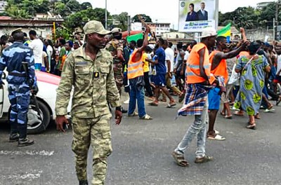 LIBREVILLE, GABON - AUGUST 30: Supporters of the military administration gather on a street after Gabonese army officers enter the national television building following the announcement of the presidential election results and announce that they take over, in Libreville, Gabon on August 30, 2023.  Credit: Stringer / Anadolu Agency