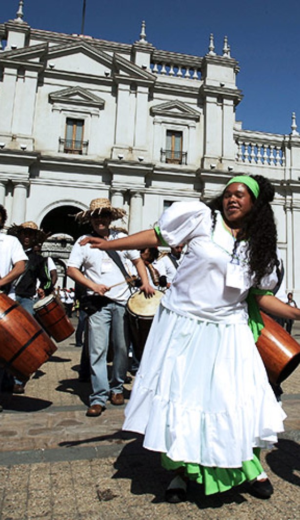 Afro-Chileans dancing and playing music