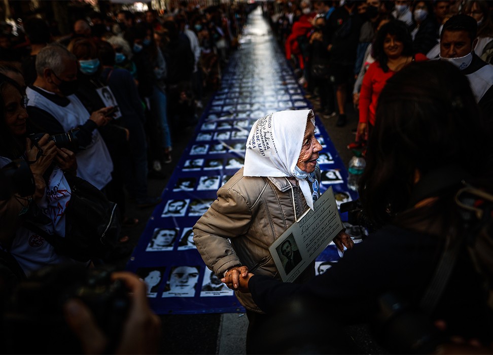 Argentines participate in a march for National Day of Memory for Truth and Justice, which commemorates the 1976 military coup. © Credit – EPA-EFE/Juan Ignacio Roncoroni.