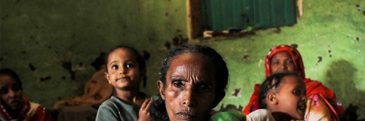 Ethiopian woman with children behind