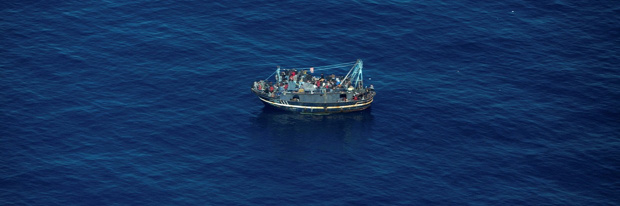 A boat in distress is pictured in the Central Mediterranean Sea. April 10, 2023. Giacomo Zorzi/Sea-Watch/Handout via REUTERS 