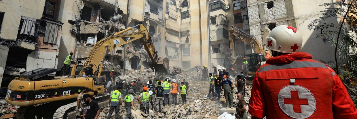 Rescuers sift through the rubble at the scene of an Israeli strike that targeted Beirut's southern suburbs a day earlier, as search and rescue operations continue on September 21, 2024. 