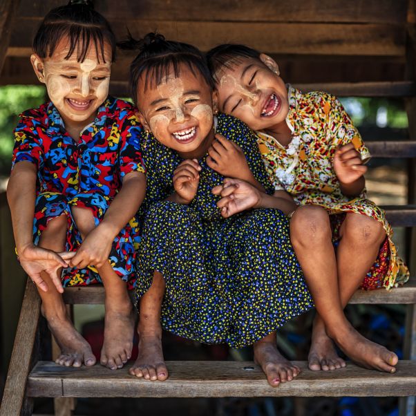 three kids smiling