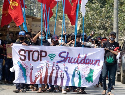 University students hold placards during a protest against the internet shutdown in Sittwe, Rakhine State, western Myanmar.
