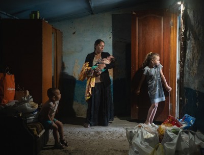 Galina and two of her children in their house on the left bank of the Nistru/Dniester river. 