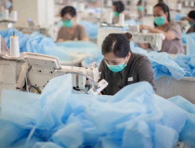 Female inmates of Lo Wu Correctional Institution are seen manufacturing isolation gowns to protect against infectious diseases, Sheung Shui, New Territories, Hong Kong, 03 May 2013. © EPA/ALEX HOFFORD